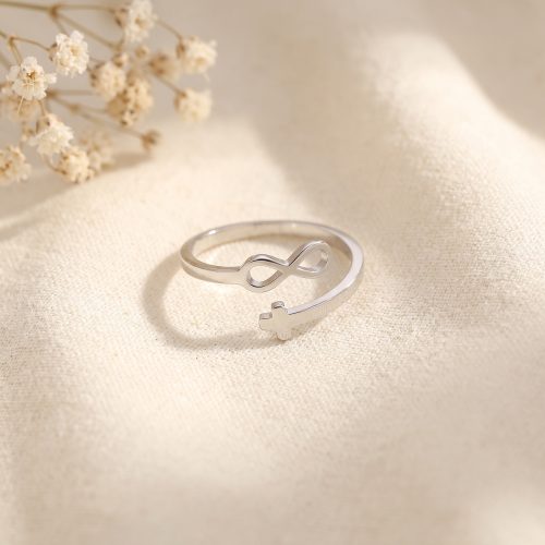 Zilveren verstelbare ring met kruisje en infinity-symbool