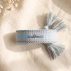 Blauw geweven armbandje met zilverkleurige believe-bedel